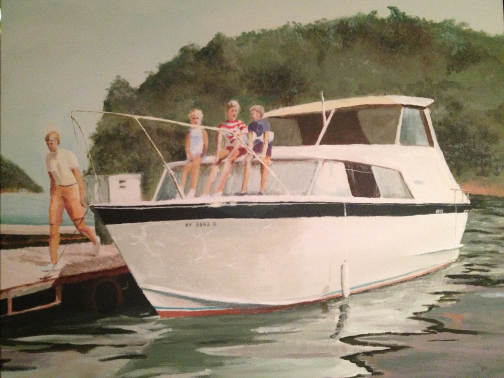 White motorboat with passengers by dock