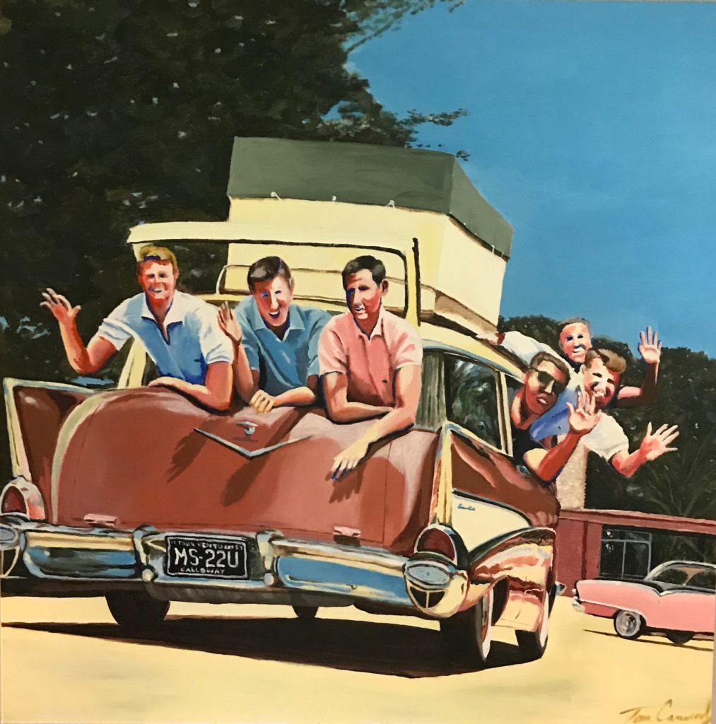Vintage station wagon with people waving
