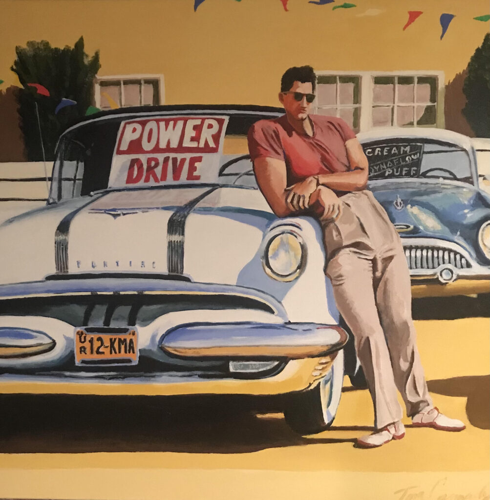 Man leaning on classic car with Power Drive