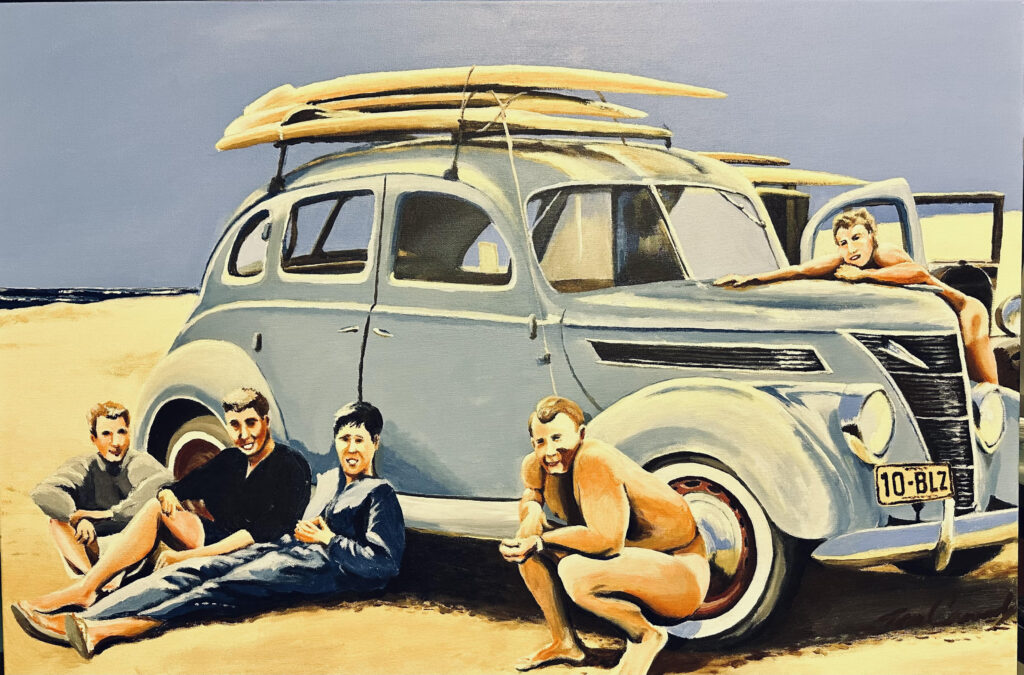 Vintage car with surfboards and beachgoers